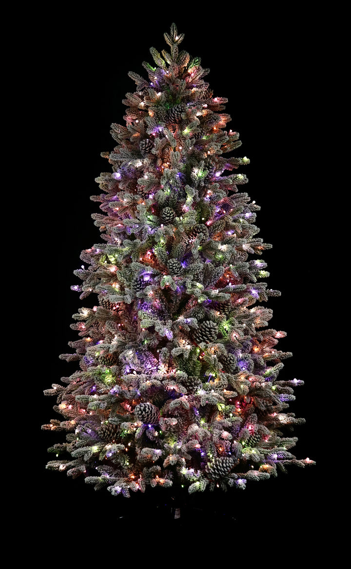 7.5' Woodland Flocked Pre-Lit LED Artificial Christmas Tree, showing pastel multi-colour lights.