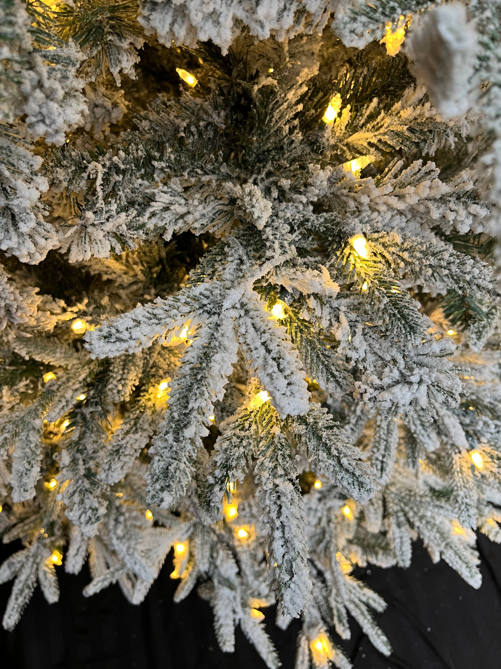 9' Mercer Flocked Pre-Lit LED Artificial Christmas Tree, close-up of foliage.